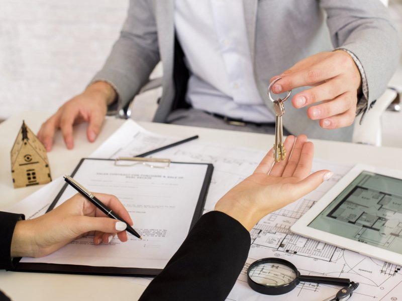 man-giving-some-keys-woman