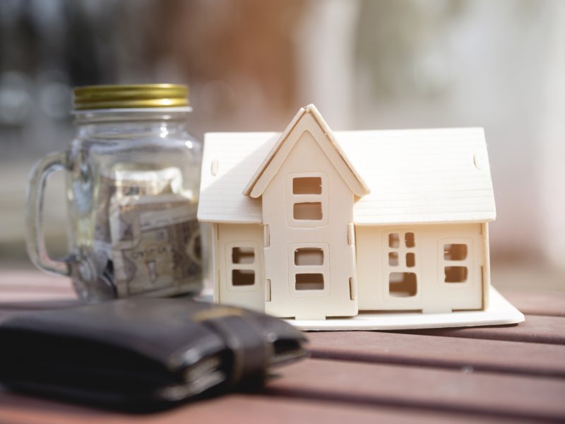 miniature-house-with-savings-jar-wallet